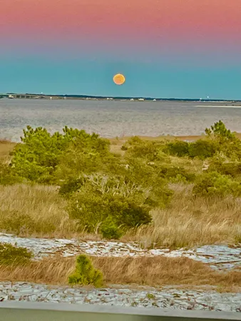 a living room with stainless steel appliances kitchen island granite countertop furniture and a kitchen view