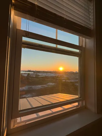 a bedroom with a bed furniture and a window