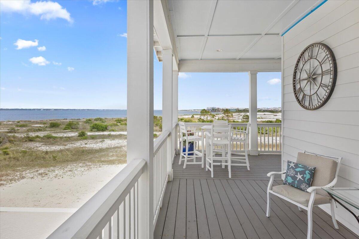 1454 Seaside Circle Navarre, FL 32566 - Photo 5 of 18 a view of a dining room with furniture window and wooden floor