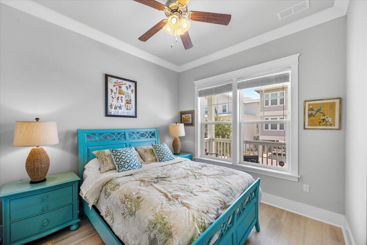 1454 Seaside Circle Navarre, FL 32566 - Photo 6 of 18 a bedroom with a large bed and a window