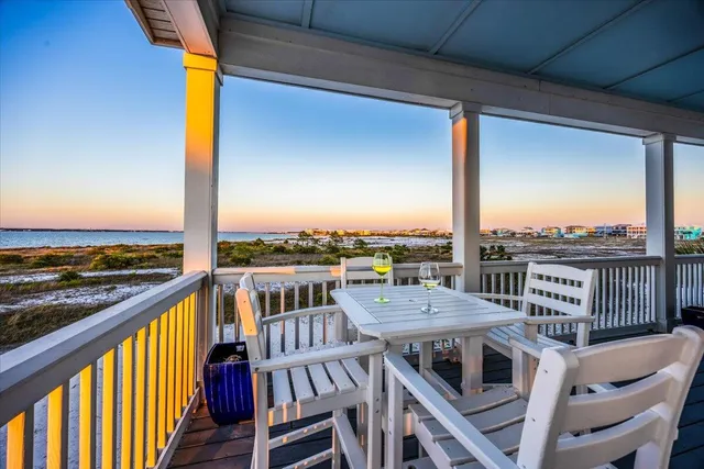 a view of a balcony with furniture