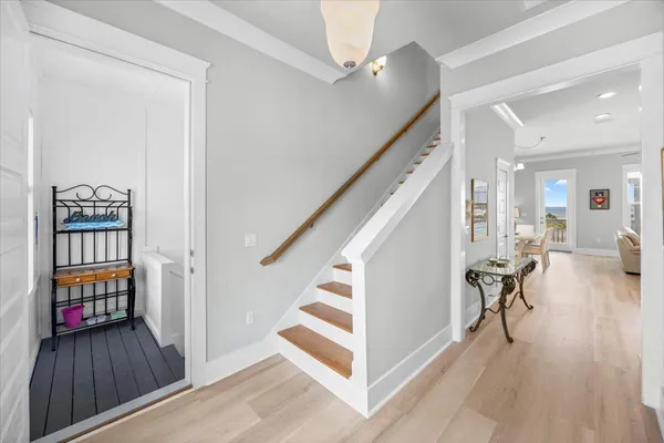 a kitchen with lots of counter space a sink appliances and living room view