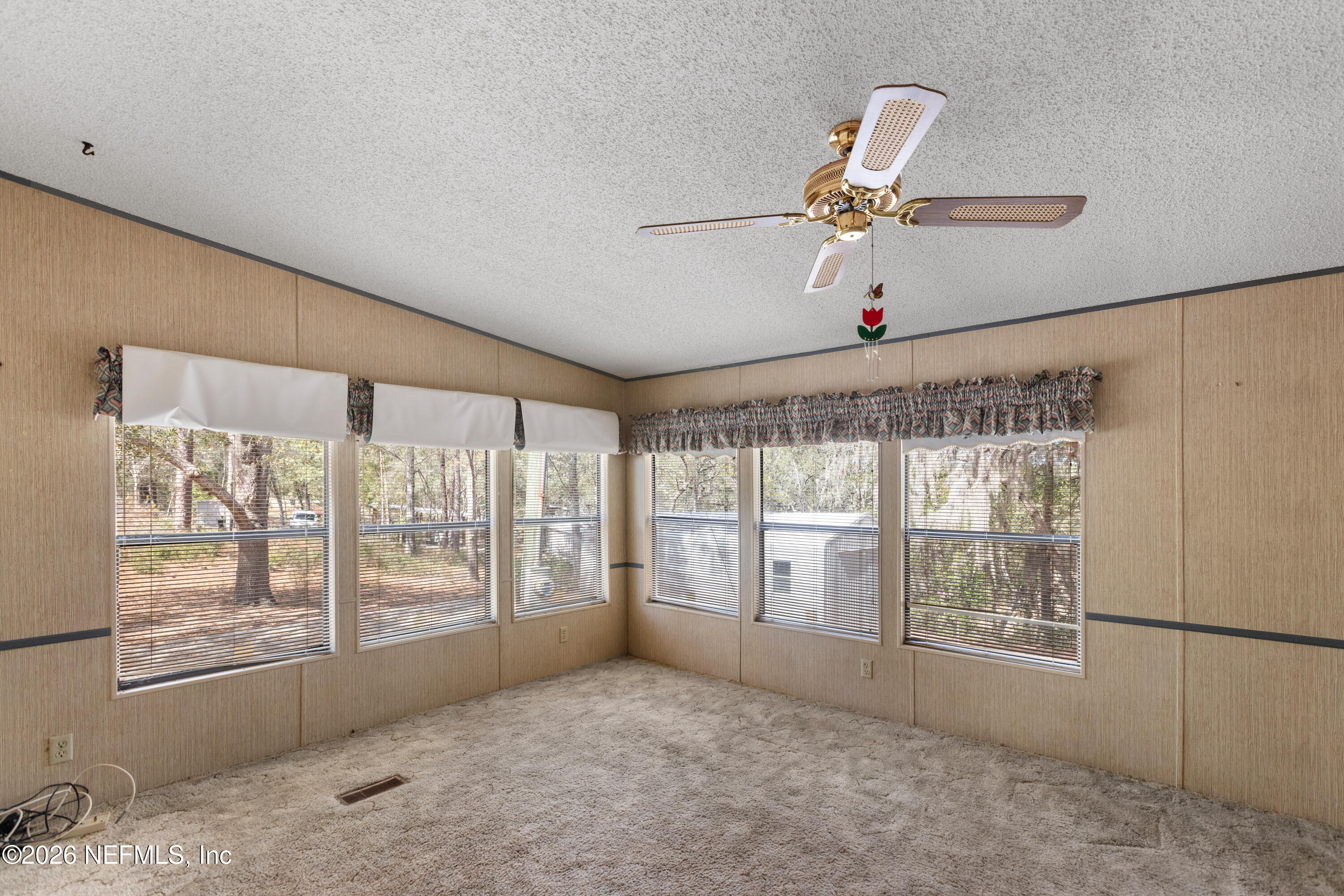 6950 Deer Springs Road Keystone Heights, FL 32656 - Photo 16 of 46 a view of an empty room with a window