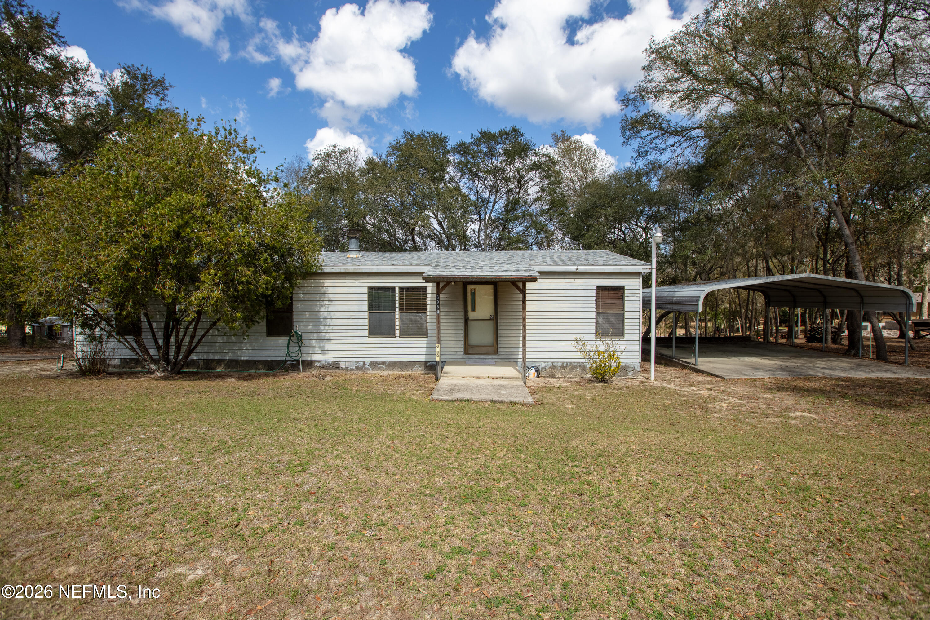 6950 Deer Springs Road Keystone Heights, FL 32656 - Photo 2 of 46 a view of a house with backyard and sitting area