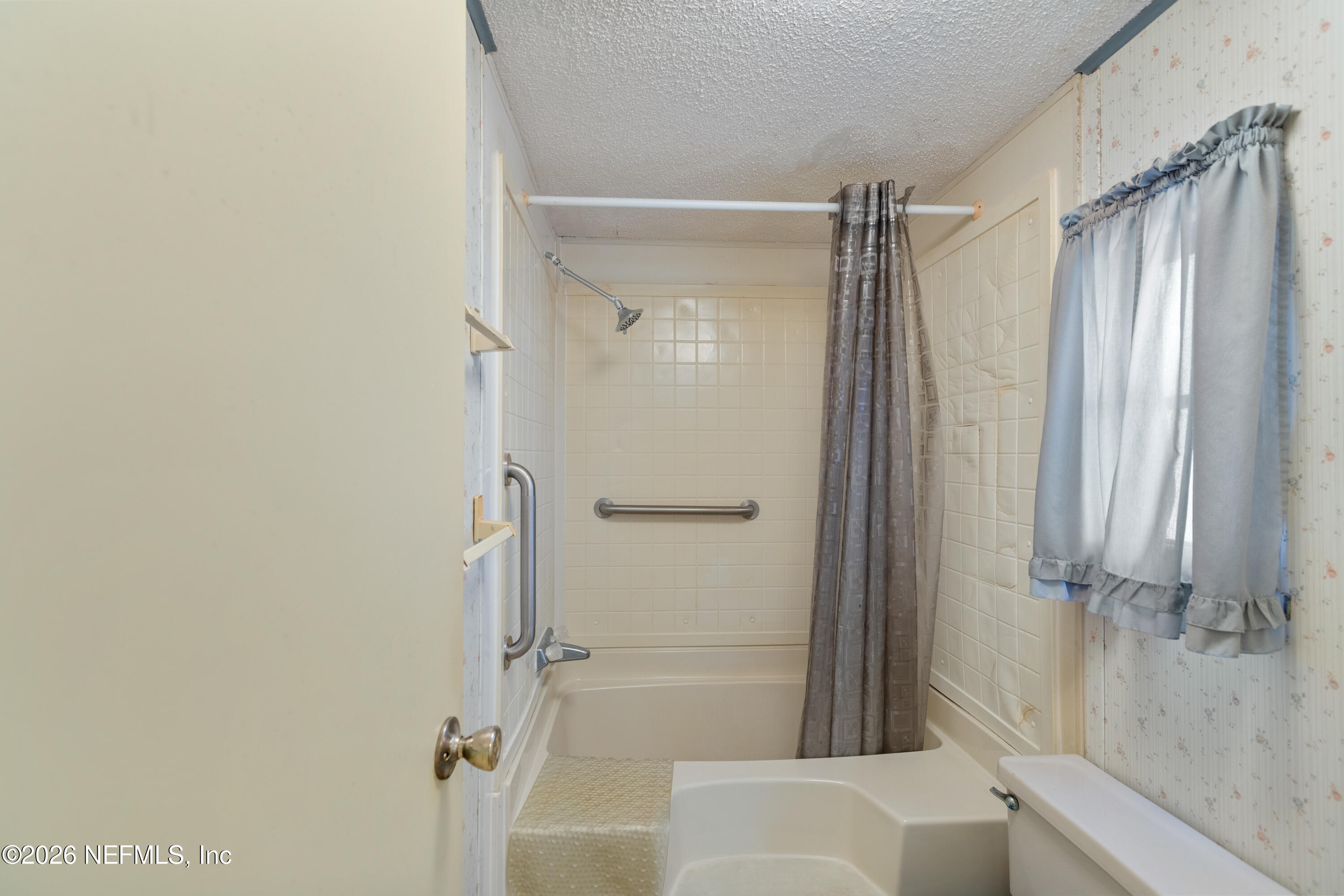 6950 Deer Springs Road Keystone Heights, FL 32656 - Photo 21 of 46 a bathroom with a shower and a glass door