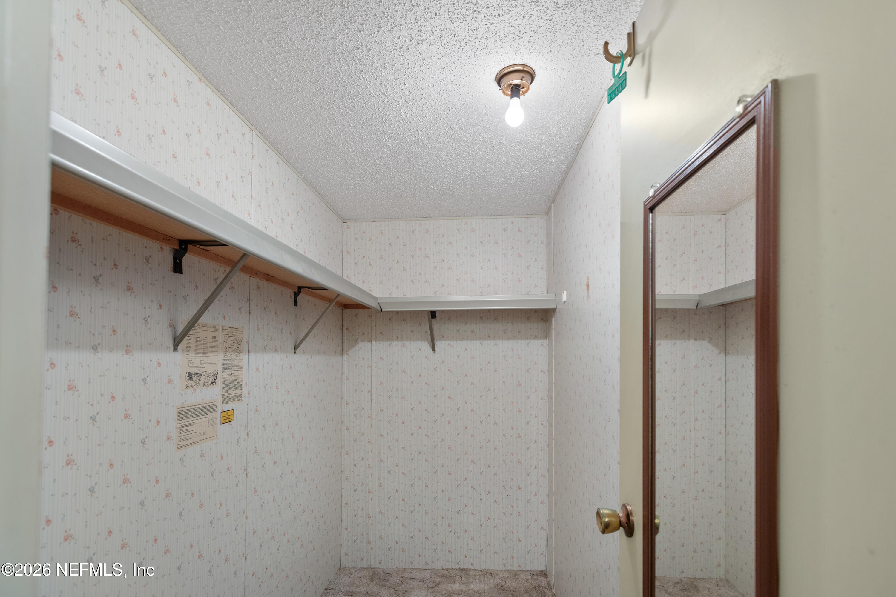 6950 Deer Springs Road Keystone Heights, FL 32656 - Photo 22 of 46 a view of walk in closet