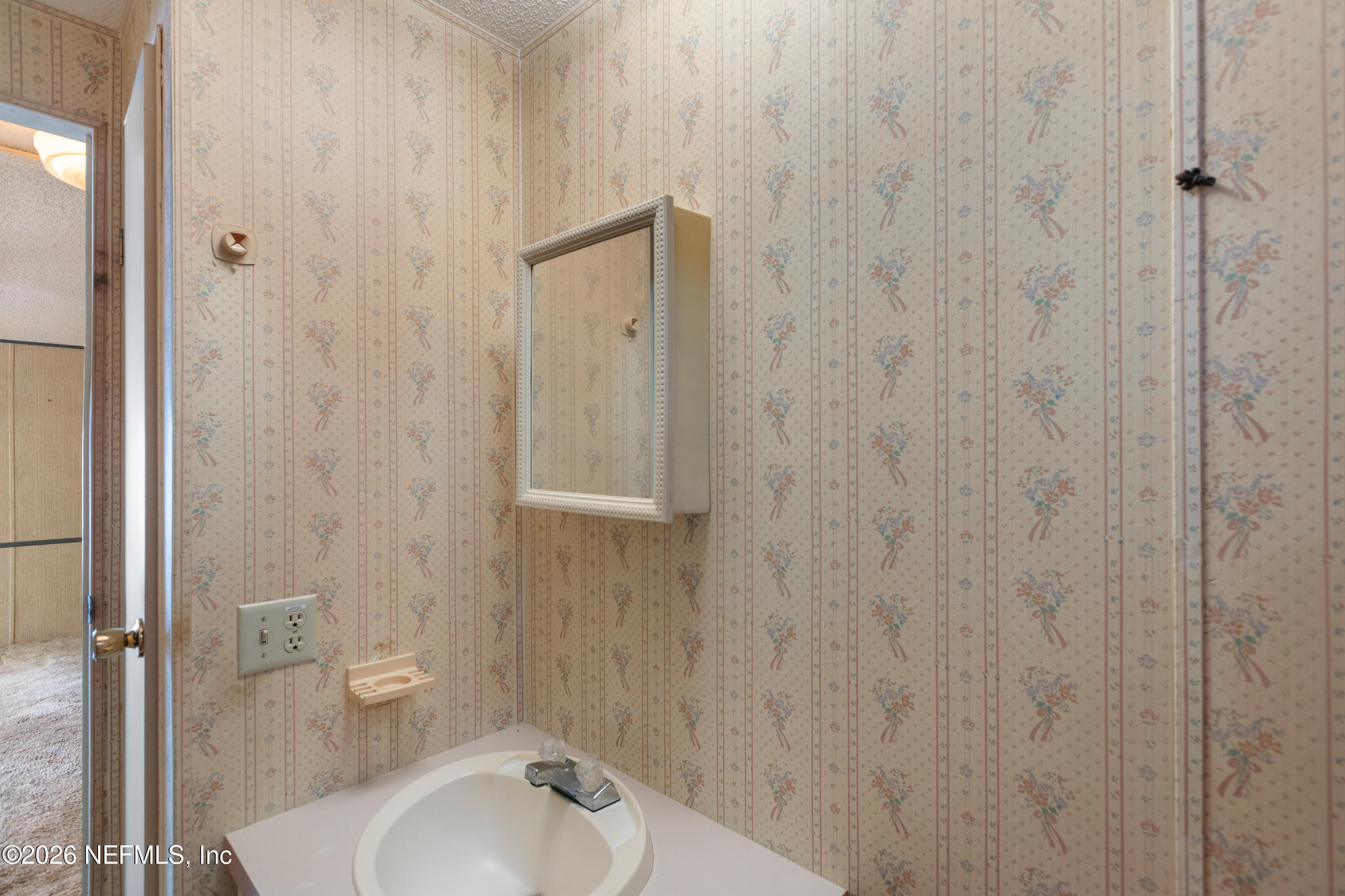 6950 Deer Springs Road Keystone Heights, FL 32656 - Photo 26 of 46 a bathroom with a sink and shower