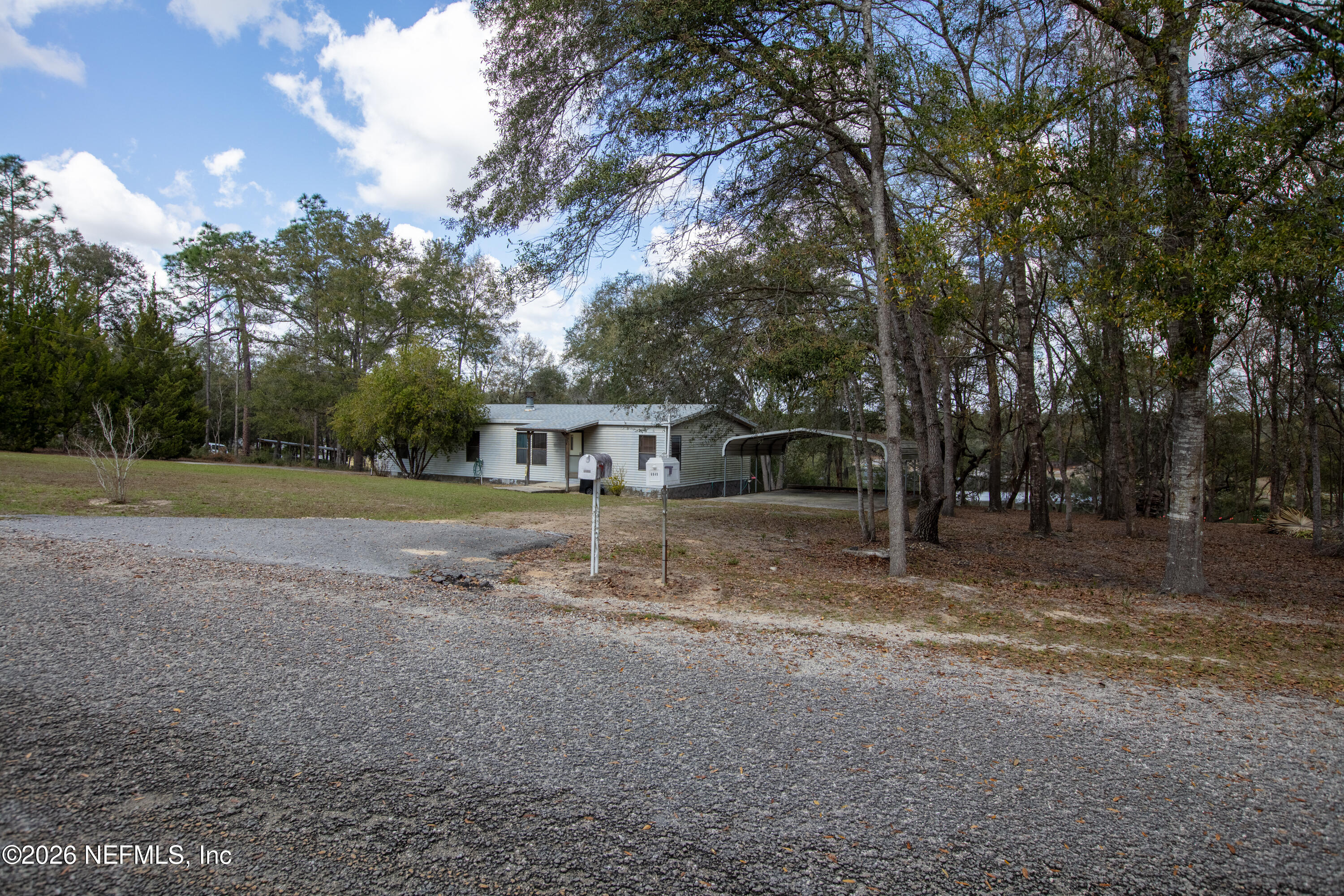 6950 Deer Springs Road Keystone Heights, FL 32656 - Photo 34 of 46 a view of a house with a yard