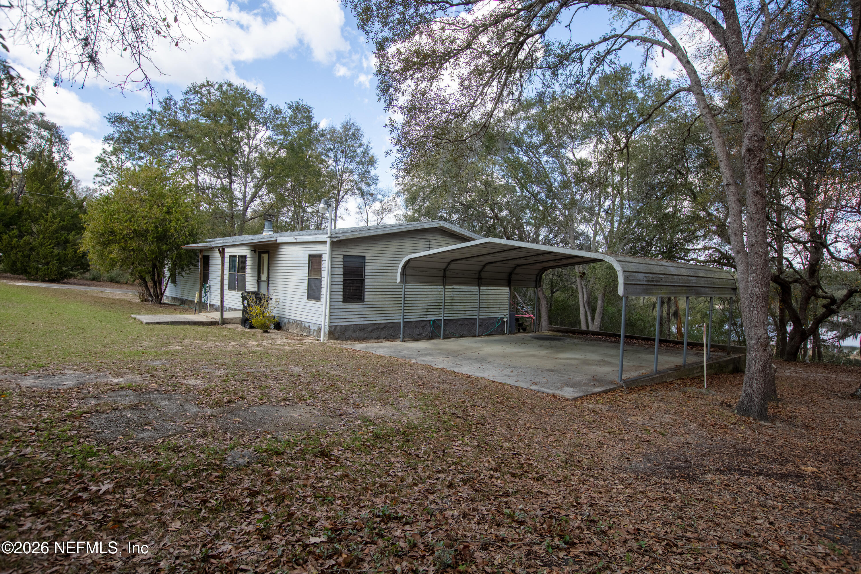 6950 Deer Springs Road Keystone Heights, FL 32656 - Photo 35 of 46 a view of a house with a yard