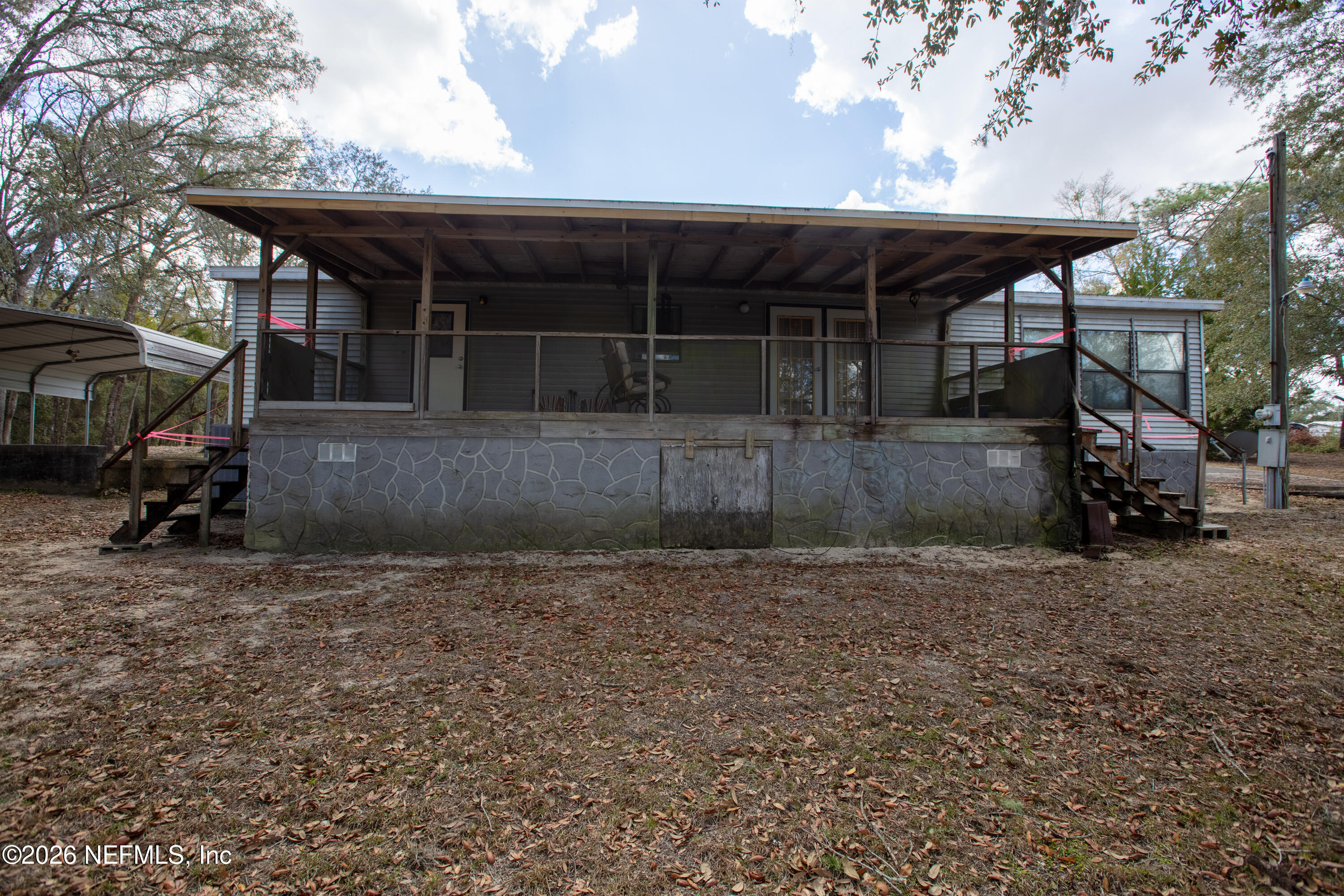 6950 Deer Springs Road Keystone Heights, FL 32656 - Photo 38 of 46 a view of a house with backyard