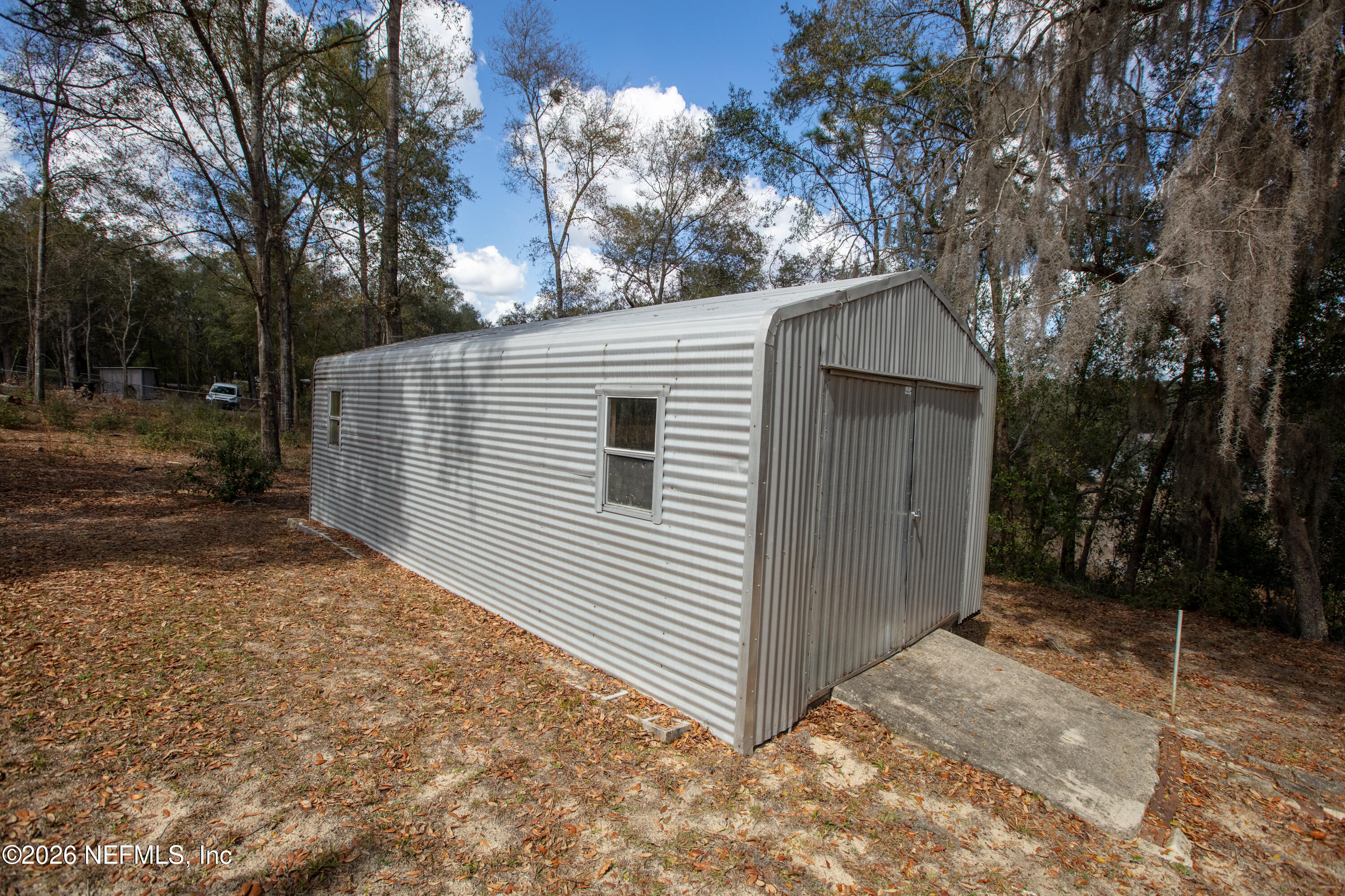 6950 Deer Springs Road Keystone Heights, FL 32656 - Photo 41 of 46 a view of backyard and tree