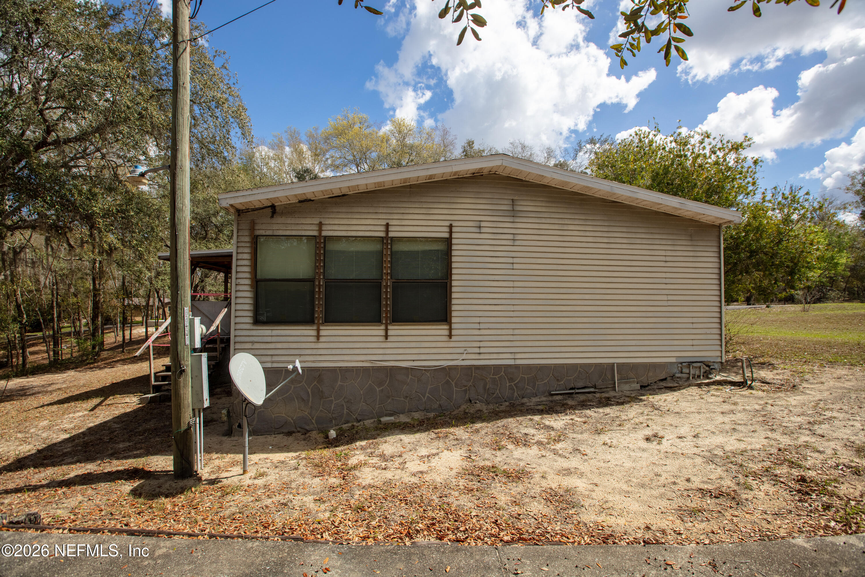 6950 Deer Springs Road Keystone Heights, FL 32656 - Photo 42 of 46 a front view of a house with garden