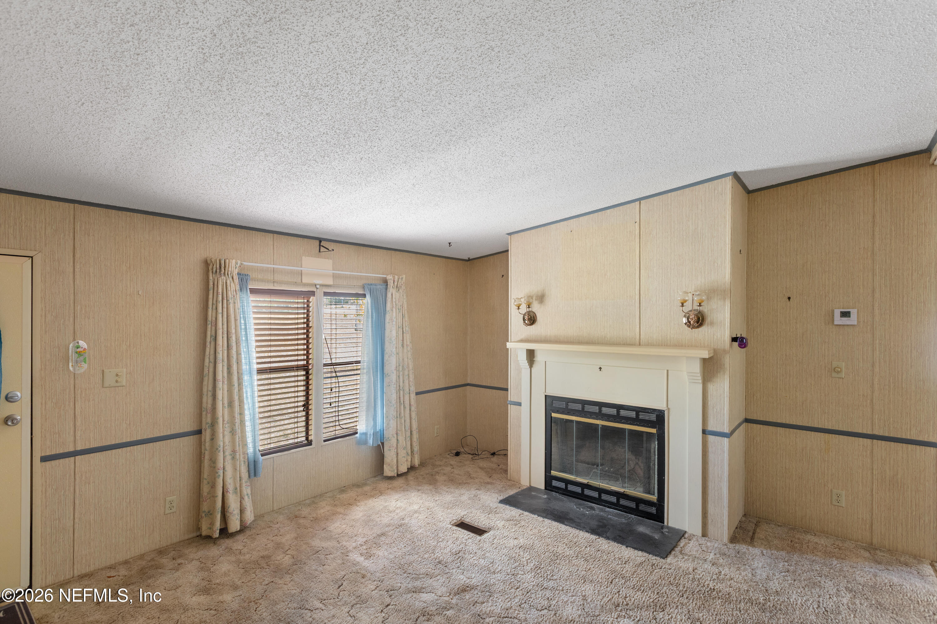 6950 Deer Springs Road Keystone Heights, FL 32656 - Photo 6 of 46 a view of a livingroom with a fireplace