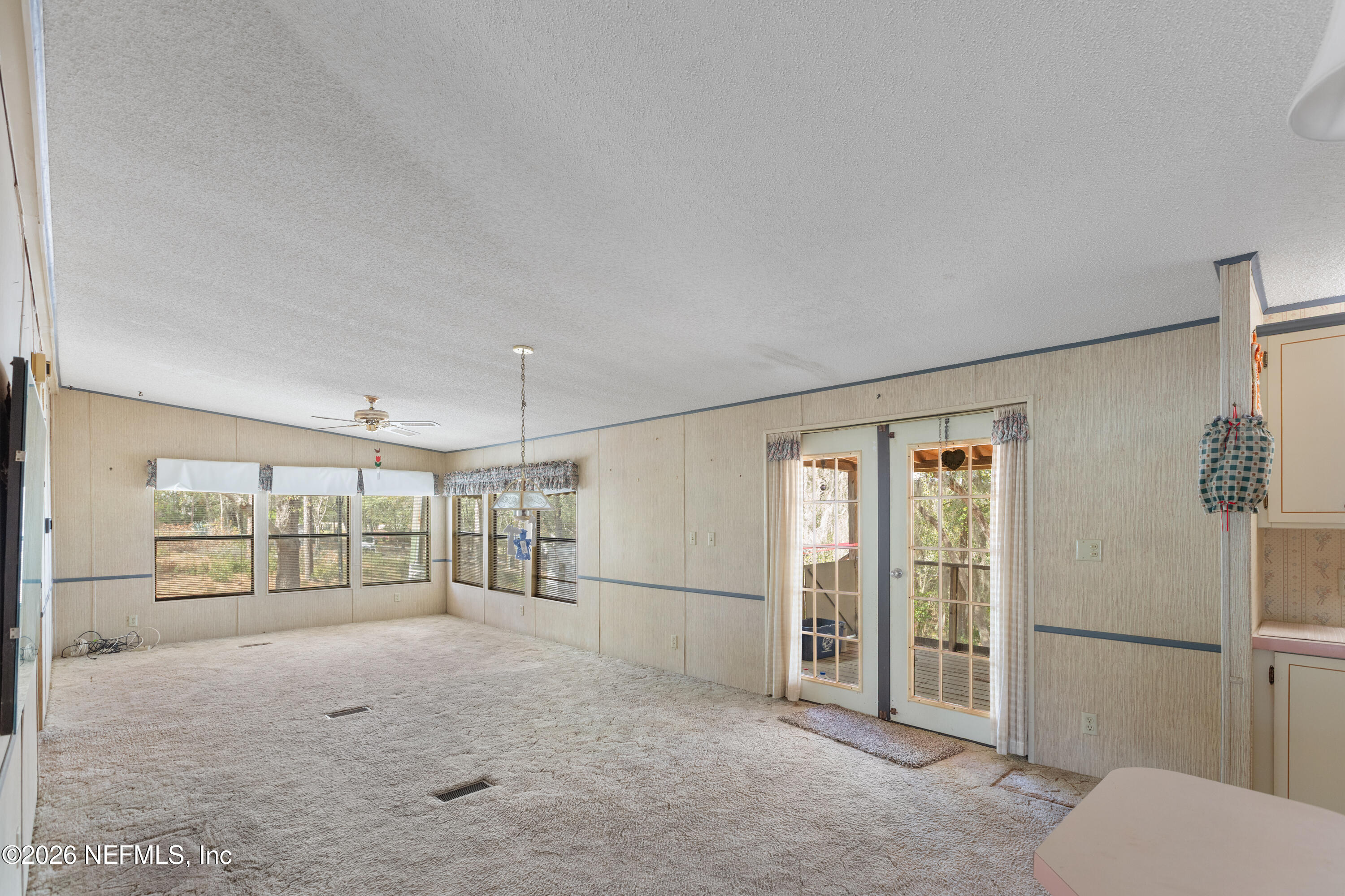 6950 Deer Springs Road Keystone Heights, FL 32656 - Photo 8 of 46 a view of livingroom with furniture and floor to ceiling window