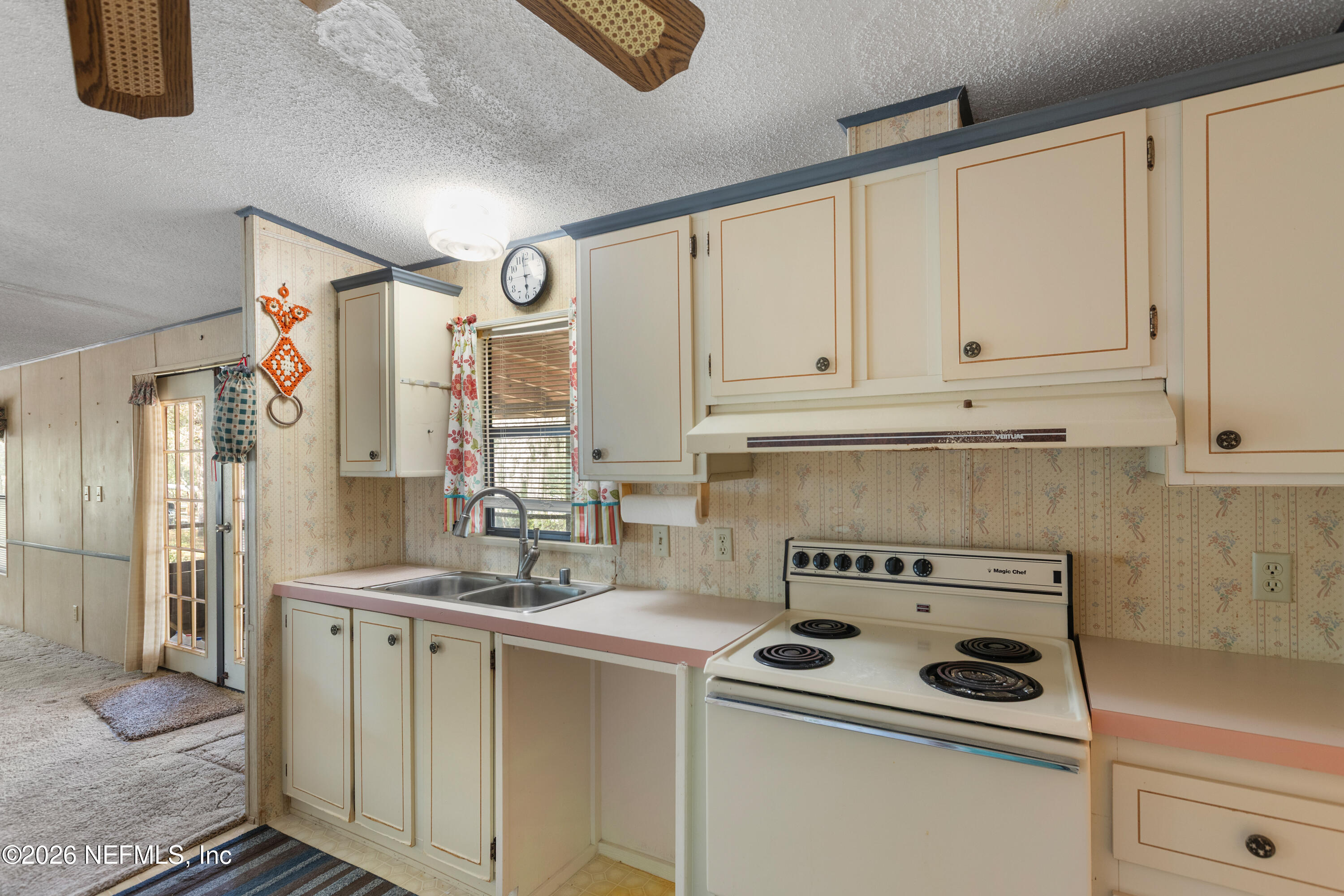 6950 Deer Springs Road Keystone Heights, FL 32656 - Photo 10 of 46 a kitchen with stainless steel appliances granite countertop a sink stove and refrigerator