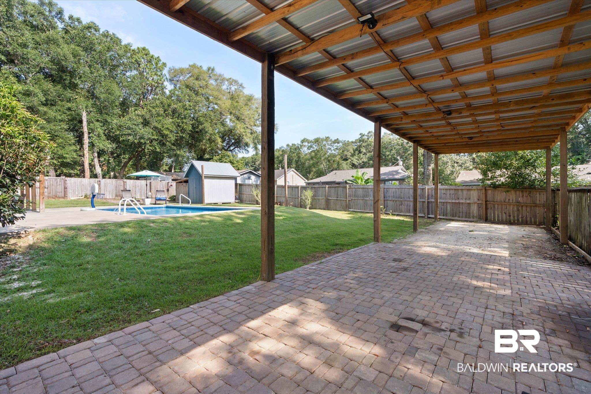123 Richmond Road Daphne, AL 36526 - Photo 26 of 35 Fenced backyard with a patio area and a shed