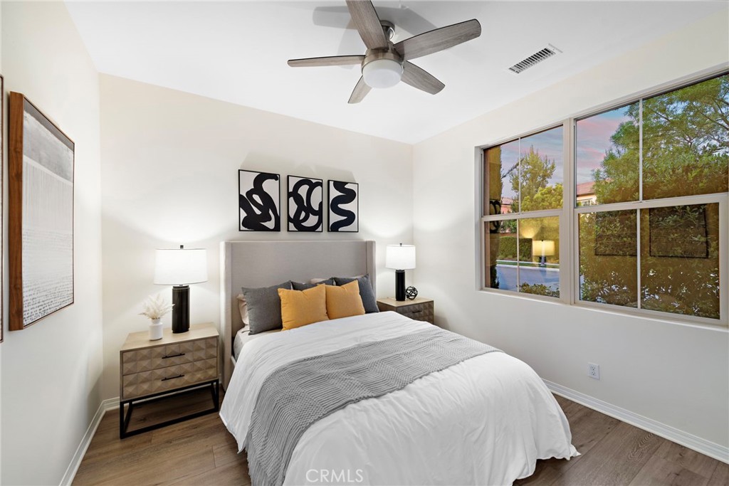 111 Henson Irvine, CA 92620 - Photo 11 of 24 a bedroom with a large bed and a large window
