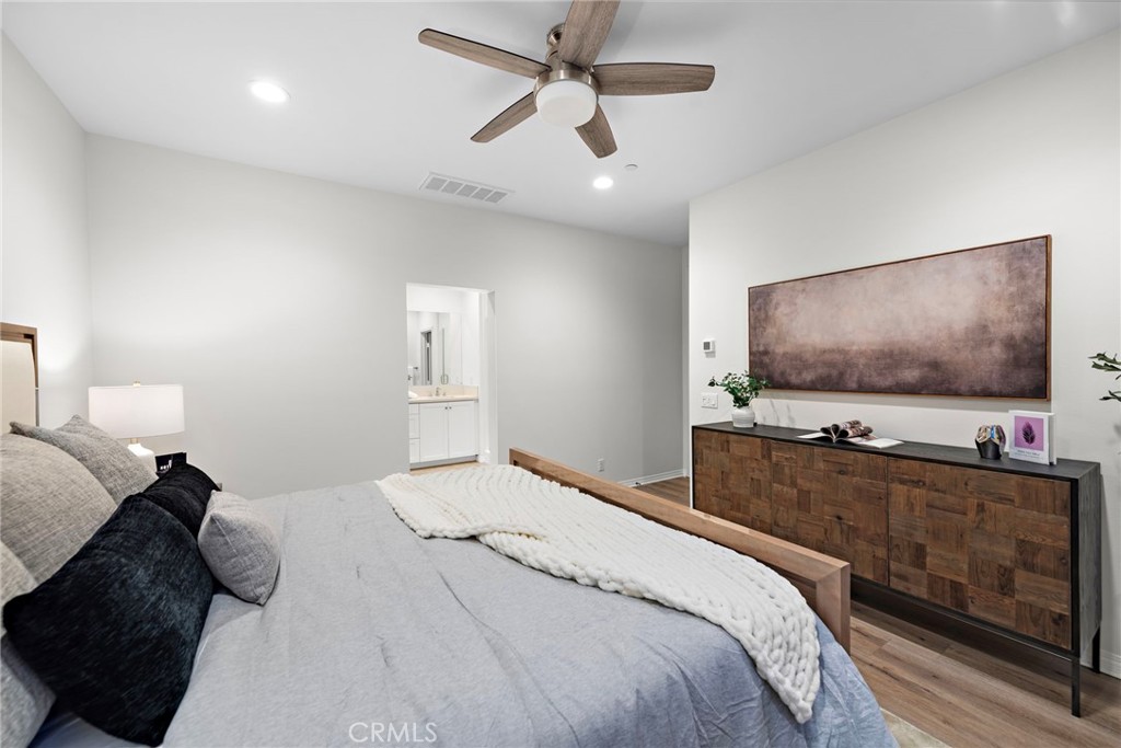 111 Henson Irvine, CA 92620 - Photo 19 of 24 a bedroom with a bed and a flat screen tv