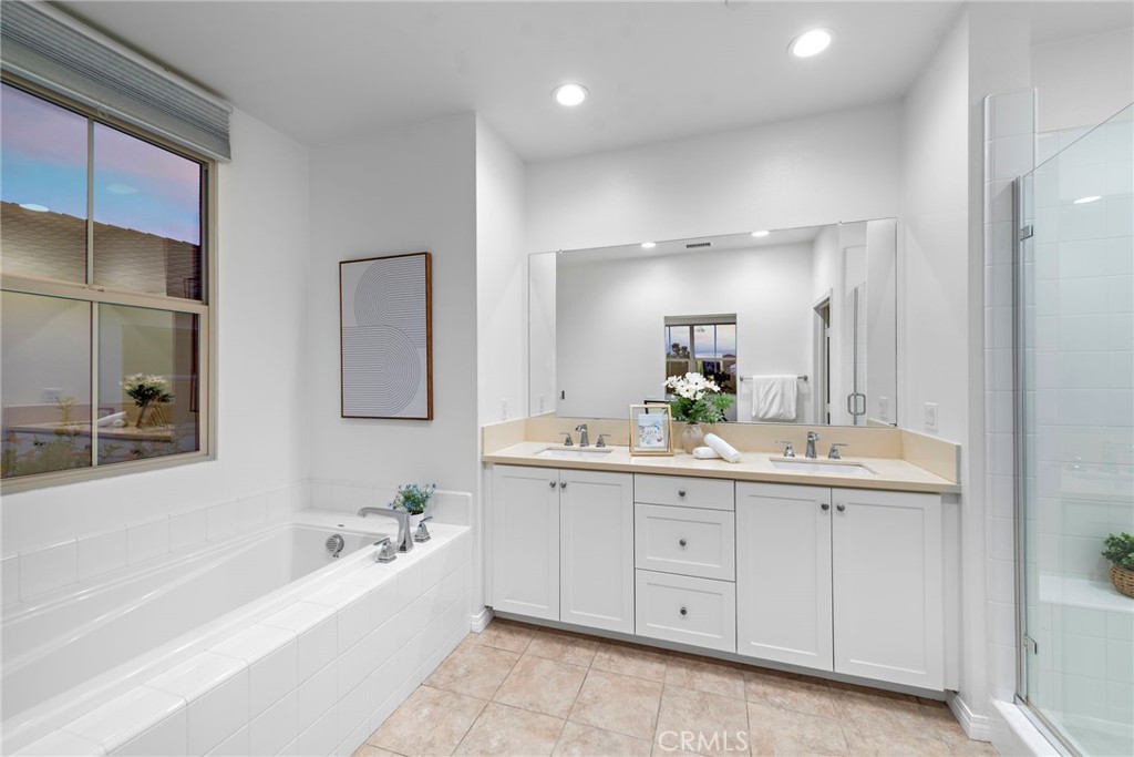 111 Henson Irvine, CA 92620 - Photo 20 of 24 a bathroom with a bathtub a double vanity sink and mirror
