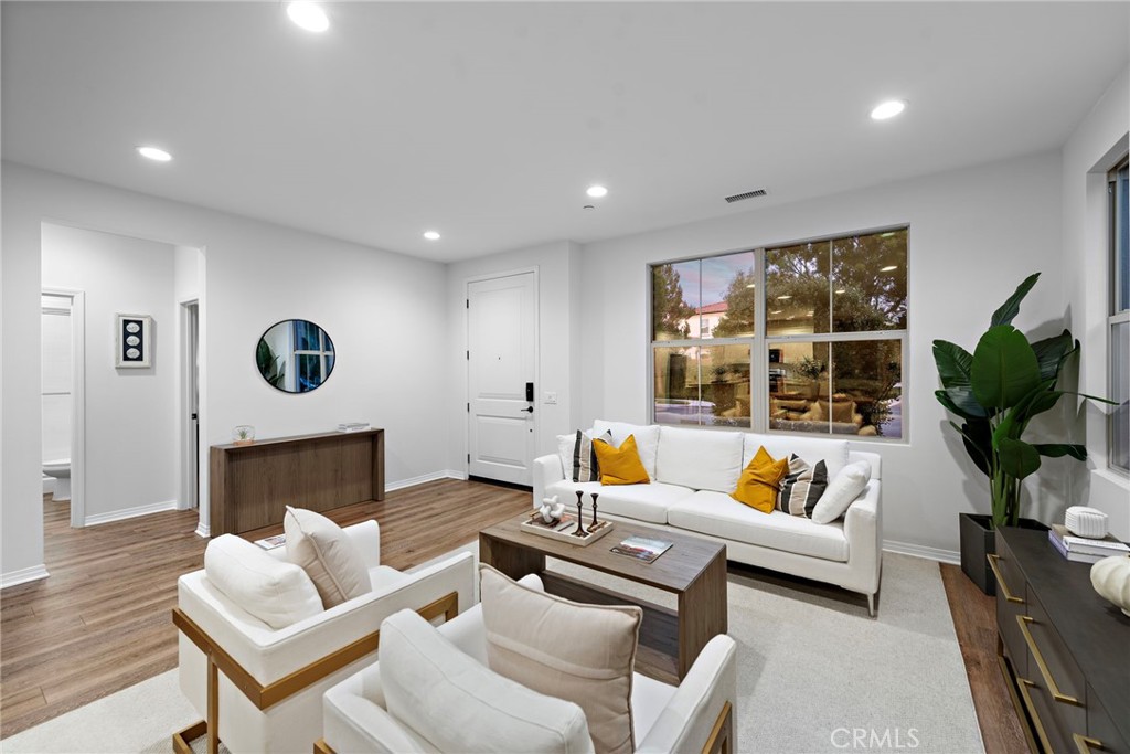 111 Henson Irvine, CA 92620 - Photo 8 of 24 a living room with furniture and a fireplace
