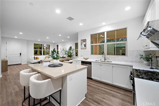 a kitchen with sink and stove