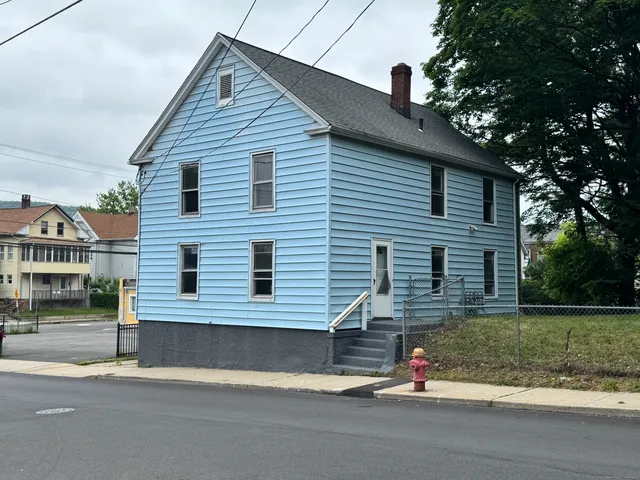 a view of a house with a street