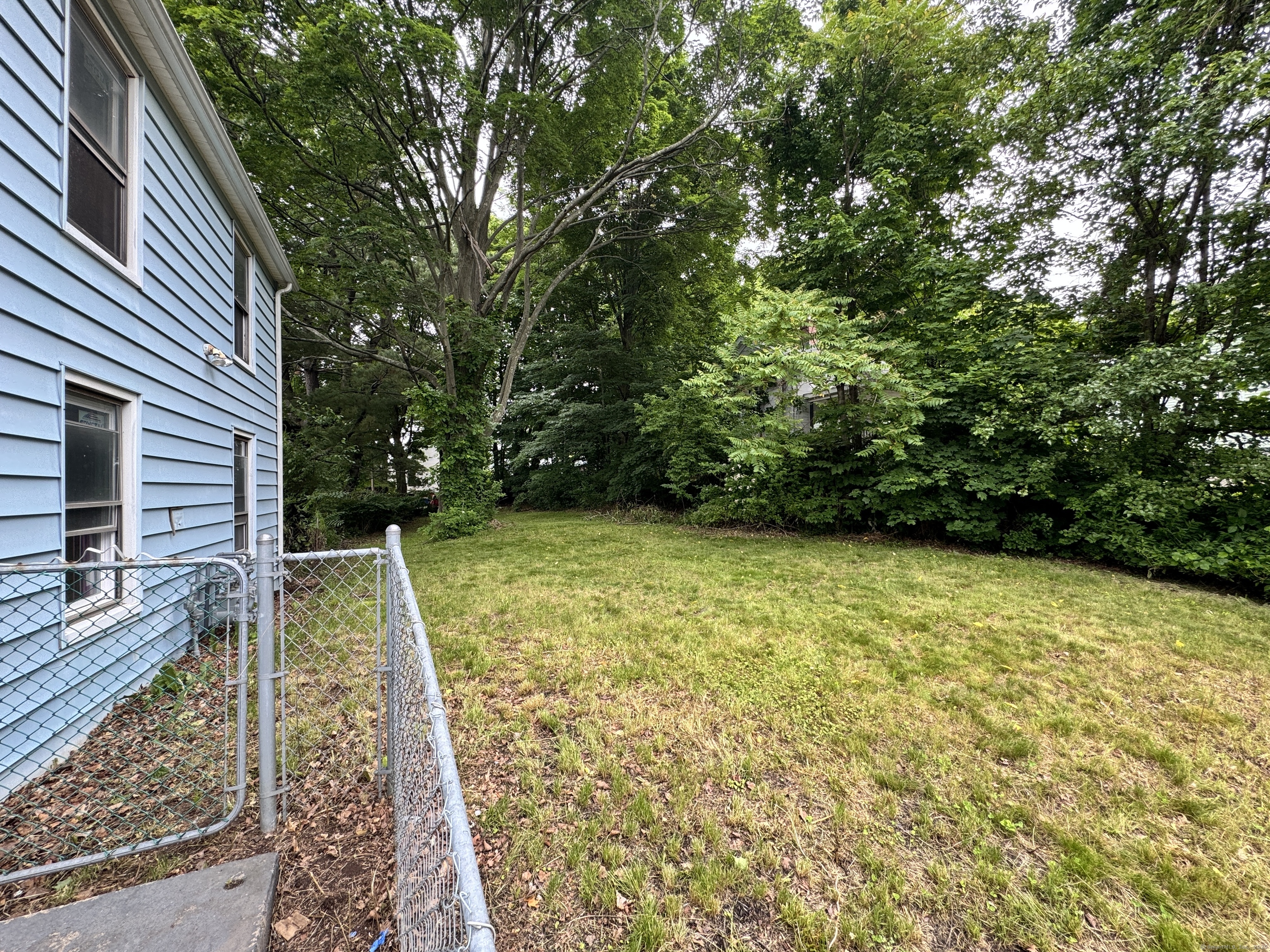 81 Springdale Avenue, Unit 2 Meriden, CT 06451 - Photo 16 of 19 a view of a backyard