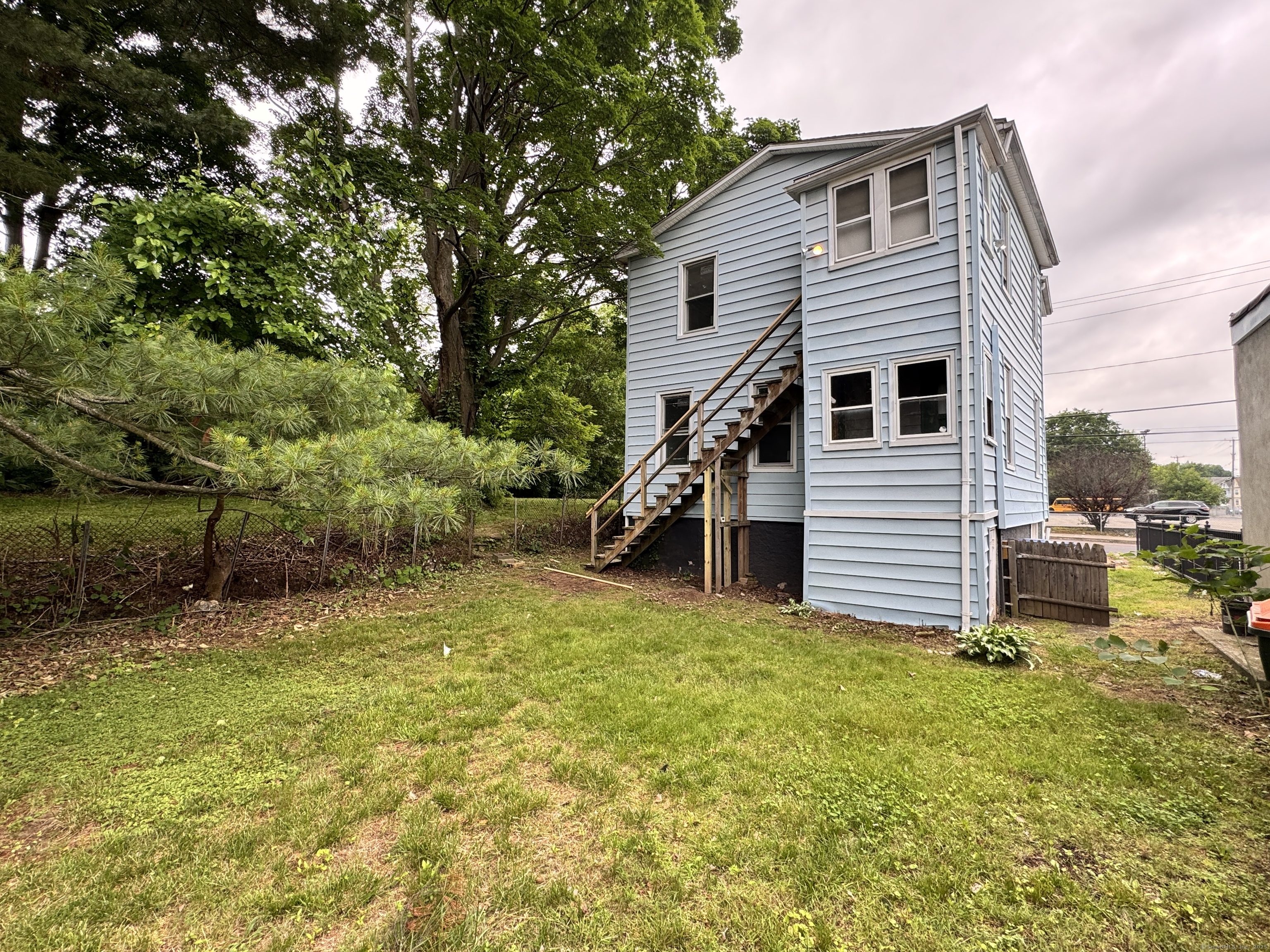 81 Springdale Avenue, Unit 2 Meriden, CT 06451 - Photo 18 of 19 a view of a house with a yard