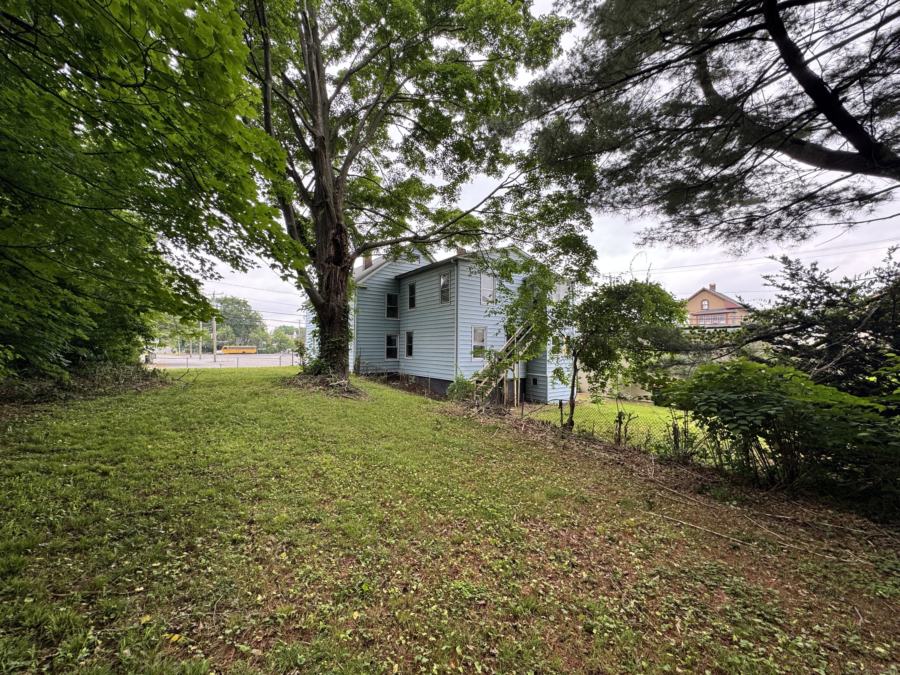 81 Springdale Avenue, Unit 2 Meriden, CT 06451 - Photo 19 of 19 a backyard of a house with lots of green space