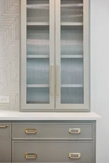 a spacious bedroom with a bed and a large mirror