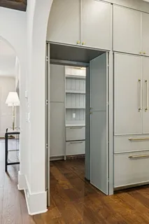 a bathroom with a double vanity sink and mirror with shower