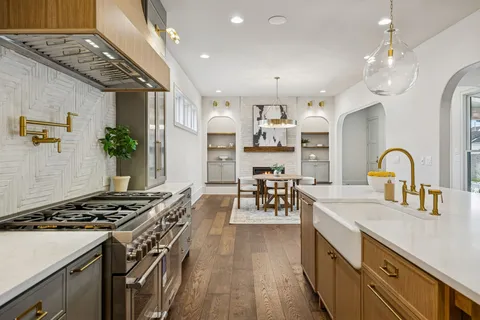 a bathroom with a bathtub and chandelier
