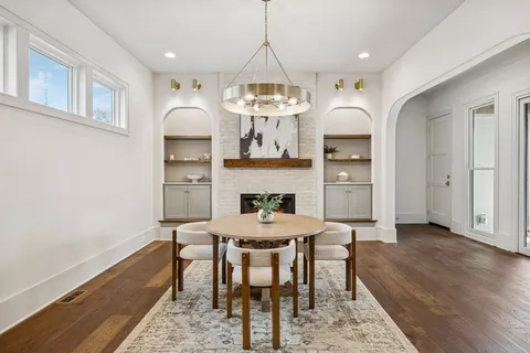 a spacious bathroom with a double vanity sink and a mirror