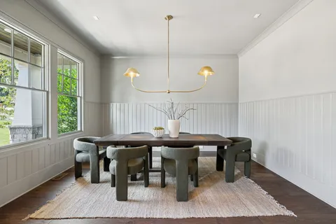 a room with chairs and window