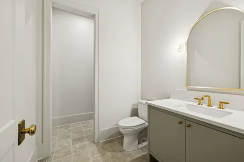 a view of an empty room and fire place