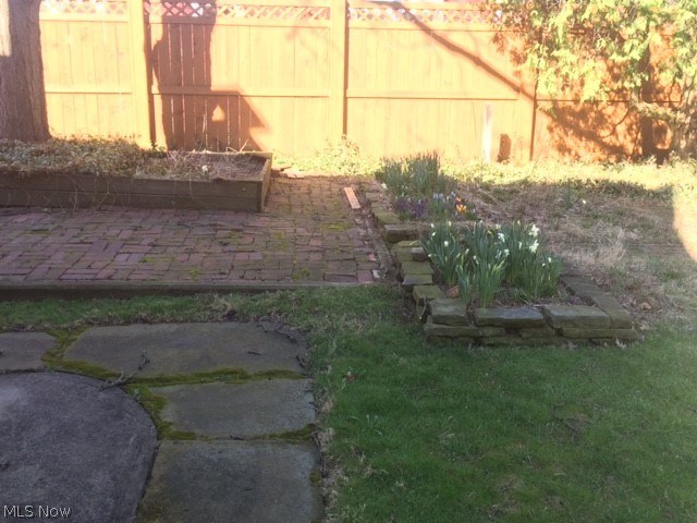 4009 Rosemond Road Cleveland Heights, OH 44121 - Photo 25 of 28 attractive yard...stone work, perennial beds, brick patio, shade tree, privacy fence.