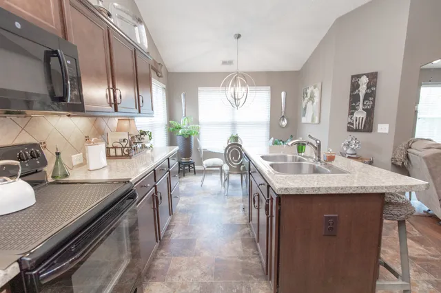 a kitchen with granite countertop lots of counter top space