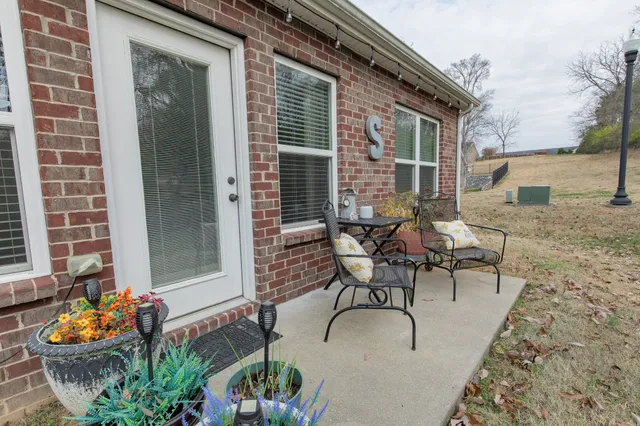 a table and chairs in front of the house