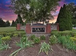 a view of a park that has large trees