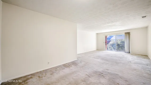 a view of an empty room and window