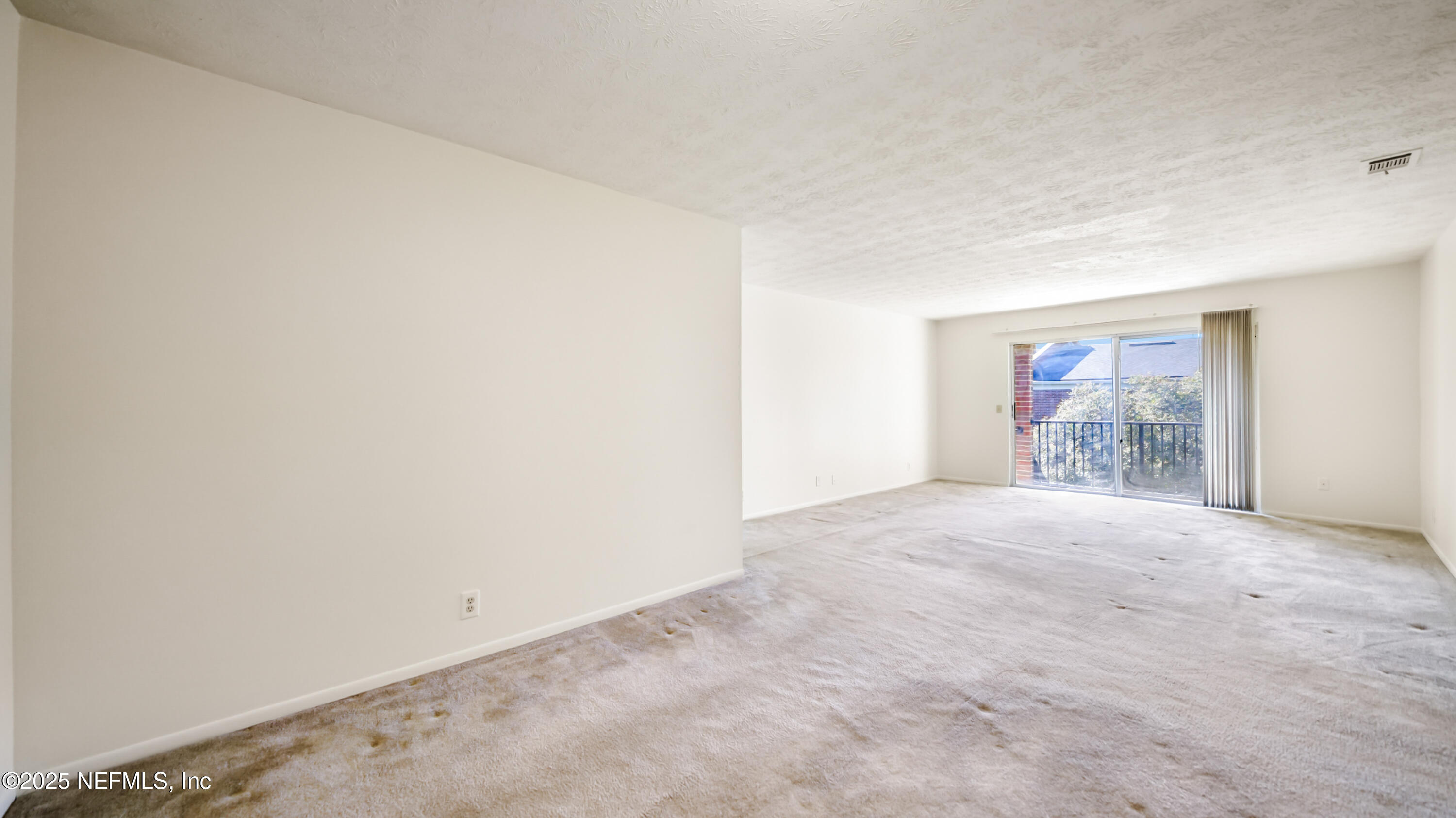 4915 Baymeadows Road, Unit 7H Jacksonville, FL 32217 - Photo 14 of 33 a view of an empty room and window