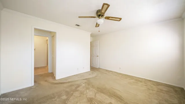 a view of a room with a fan