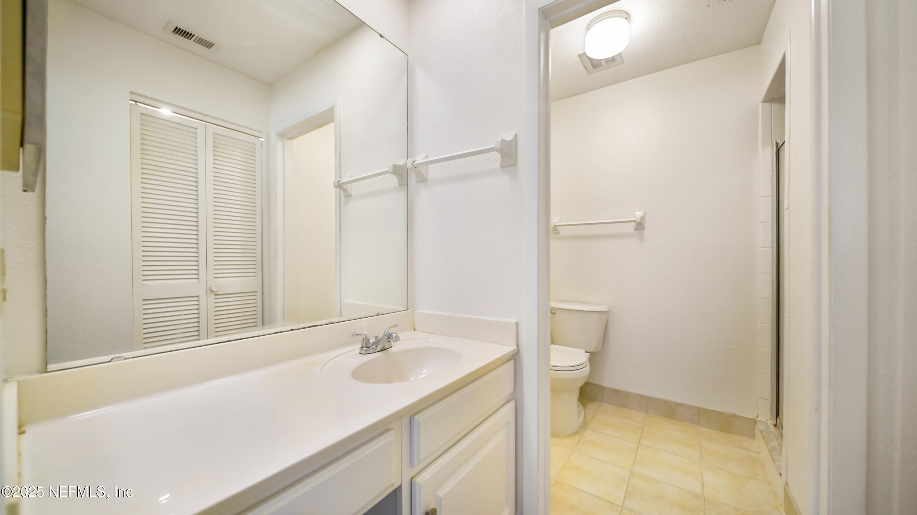 4915 Baymeadows Road, Unit 7H Jacksonville, FL 32217 - Photo 21 of 33 a bathroom with a sink and a toilet