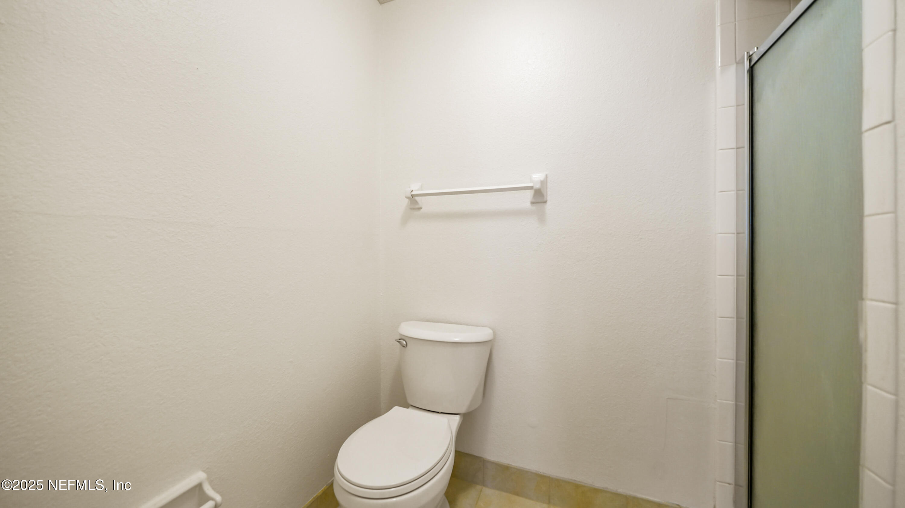 4915 Baymeadows Road, Unit 7H Jacksonville, FL 32217 - Photo 22 of 33 a white toilet sitting next to a white wall