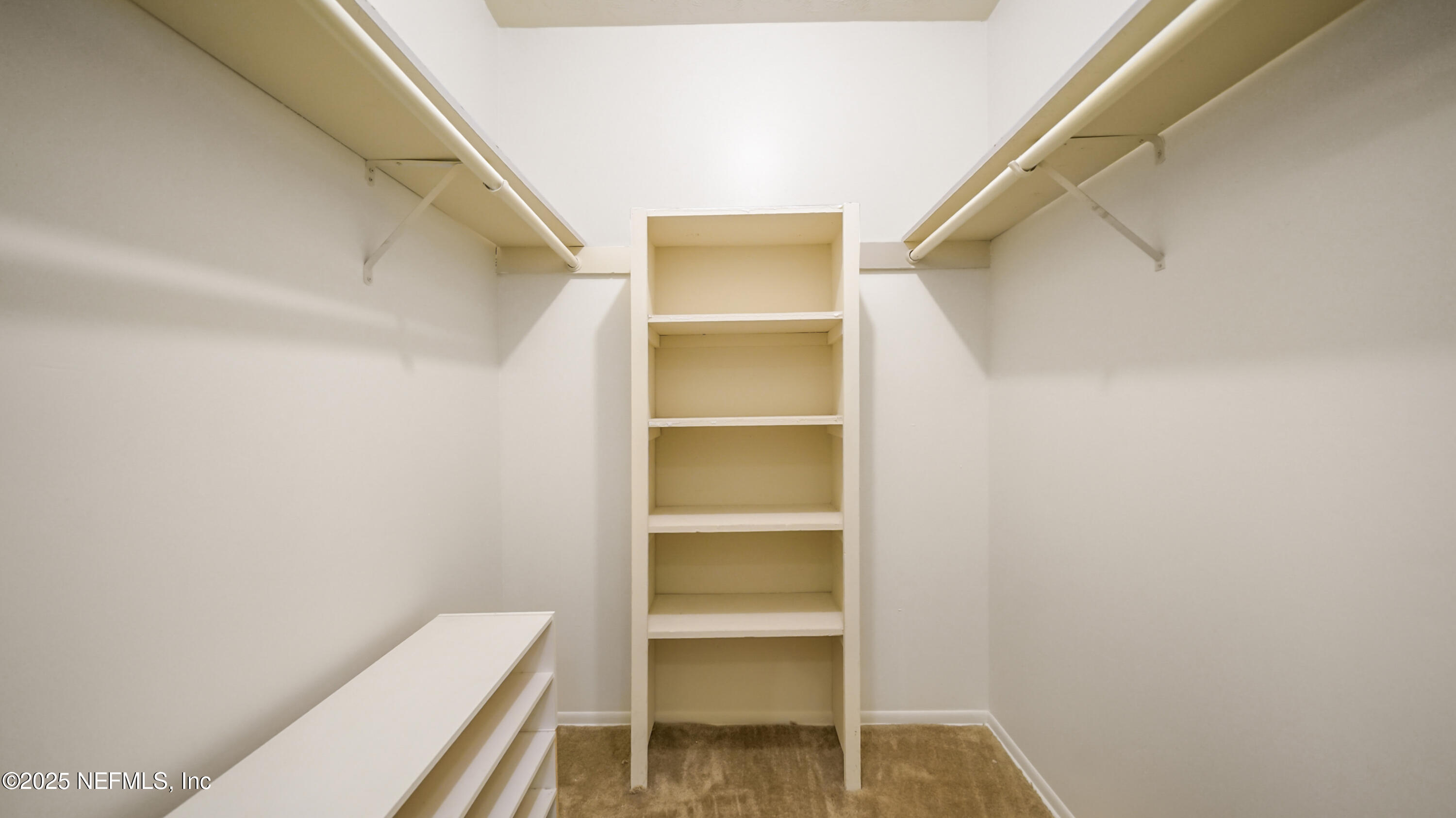 4915 Baymeadows Road, Unit 7H Jacksonville, FL 32217 - Photo 23 of 33 a view of bedroom with a closet and wooden floor