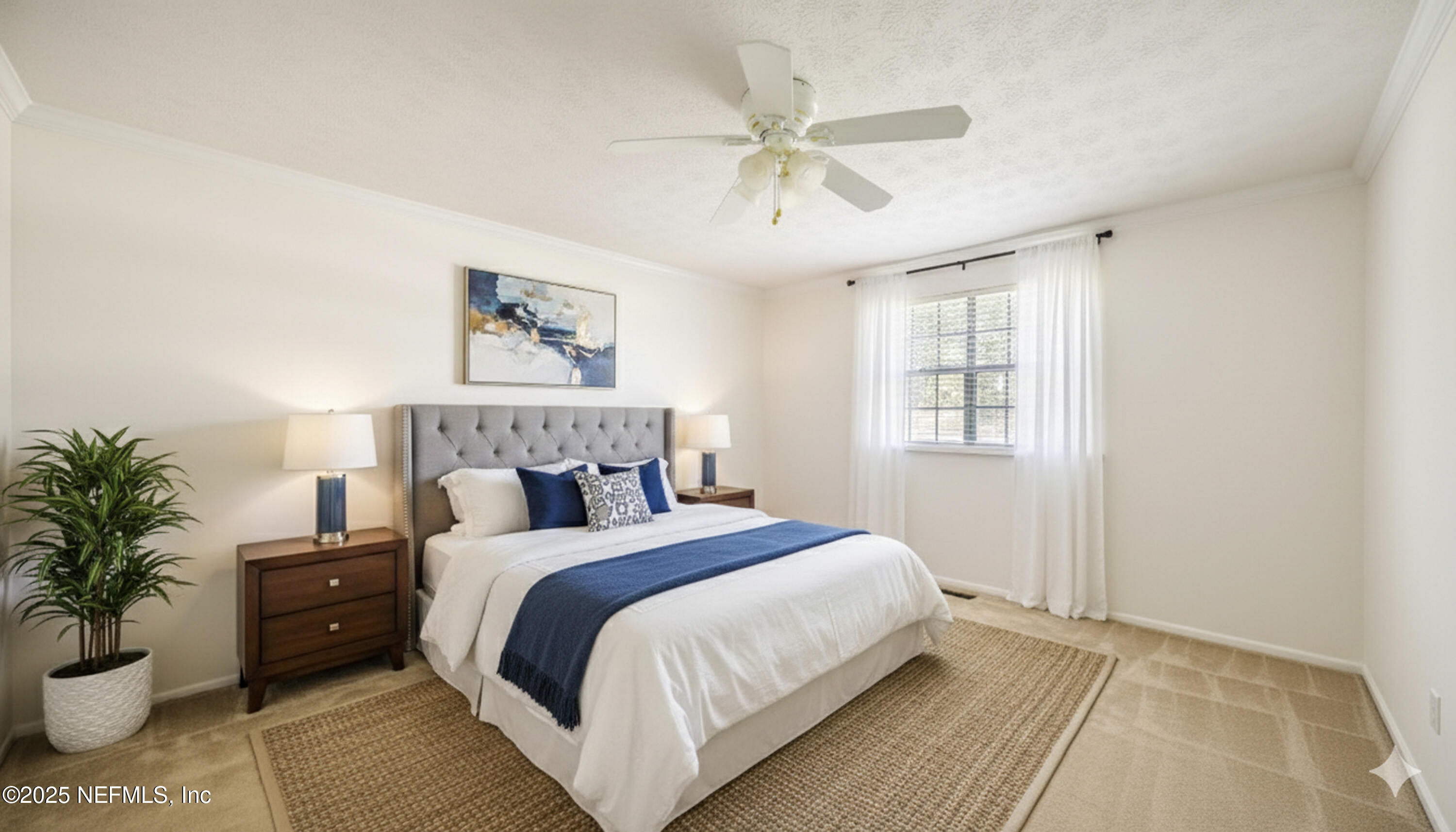 4915 Baymeadows Road, Unit 7H Jacksonville, FL 32217 - Photo 24 of 33 a bedroom with a large bed and a chandelier