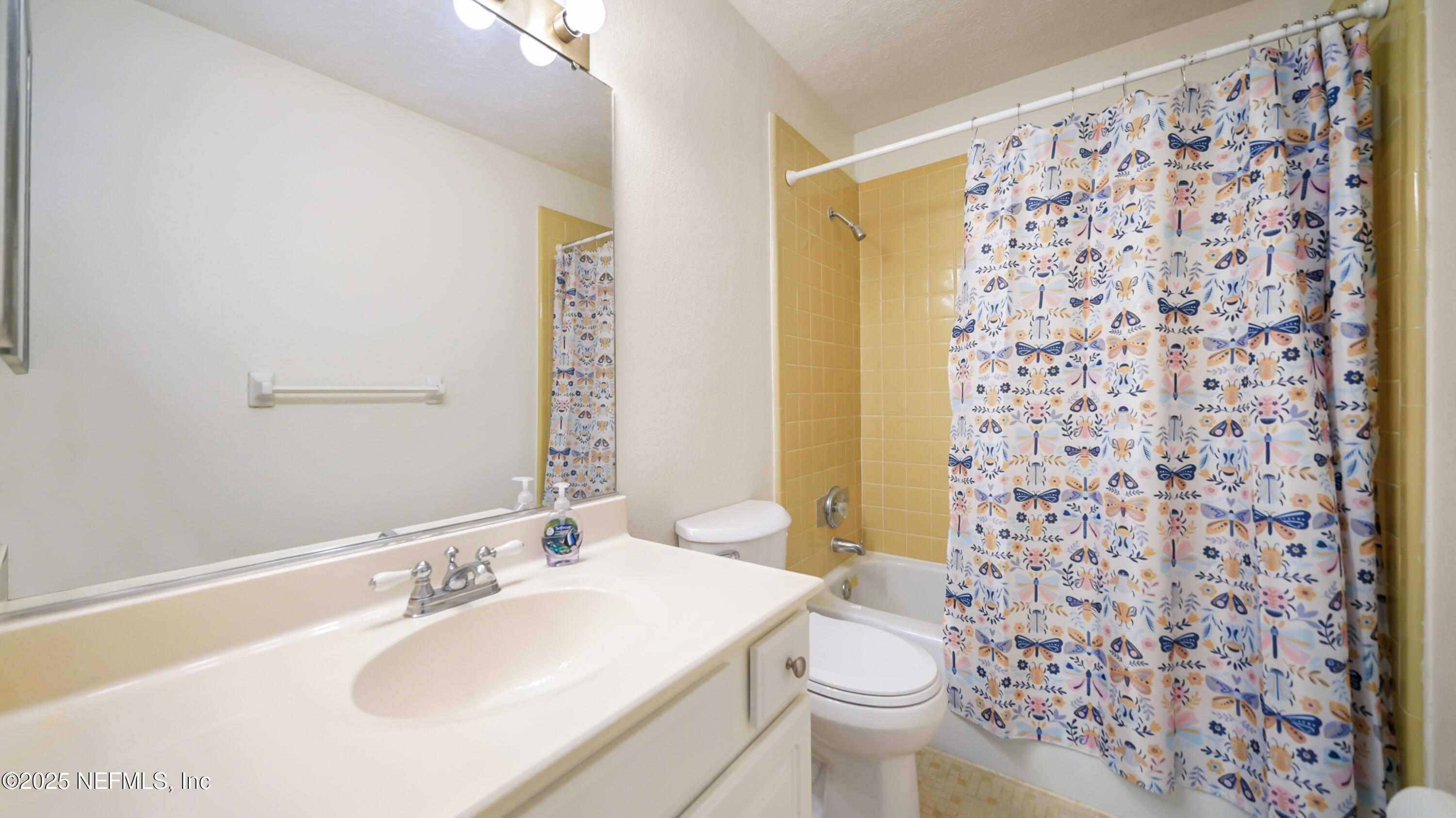 4915 Baymeadows Road, Unit 7H Jacksonville, FL 32217 - Photo 27 of 33 a bathroom with a sink toilet and shower