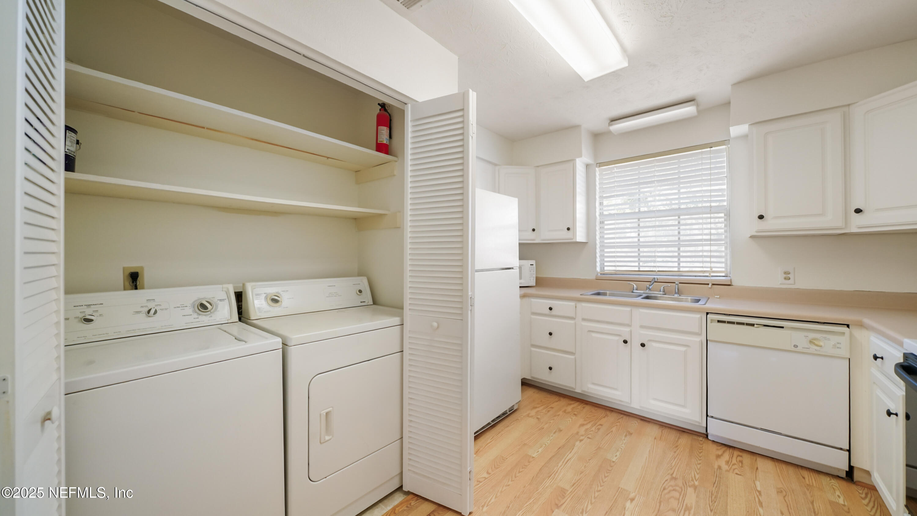 4915 Baymeadows Road, Unit 7H Jacksonville, FL 32217 - Photo 10 of 33 a utility room with closet dryer and washer