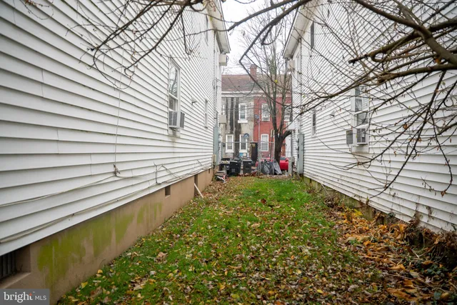 a view of a backyard with sitting area