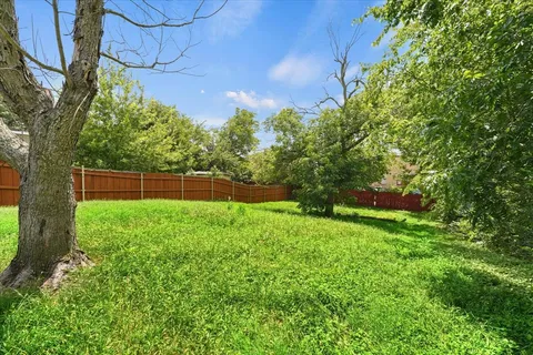 a backyard of a house with lots of green space
